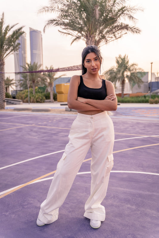 Girl with white stitch Women cargo pants from embody dubai