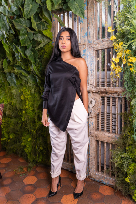 Girl in a black coloured Women cotton shirt designed as a sleek one-shoulder shirt.