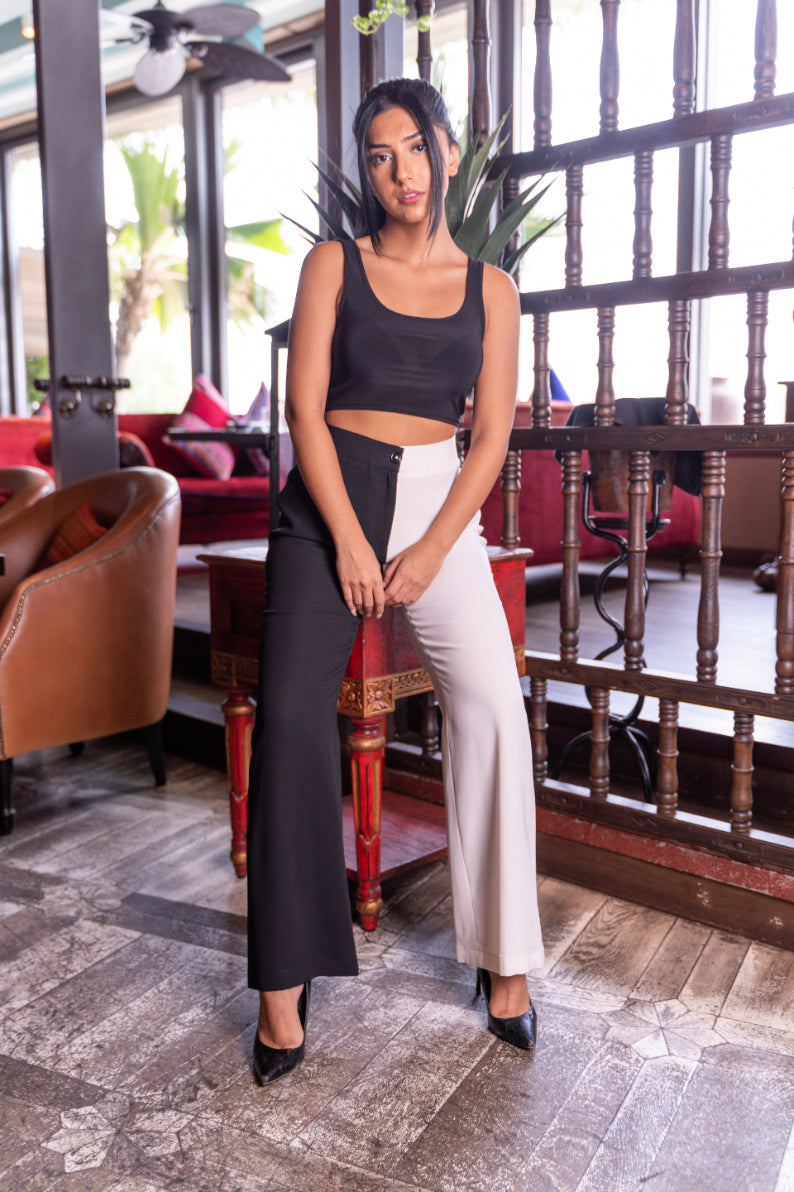 Girl in dual tone straight fit classic pants made with soft crepe.