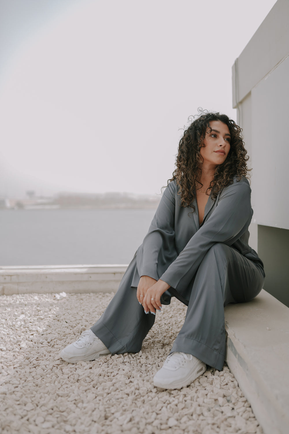 Girl posing in a simplistic stylish grey colored classic loungewear 