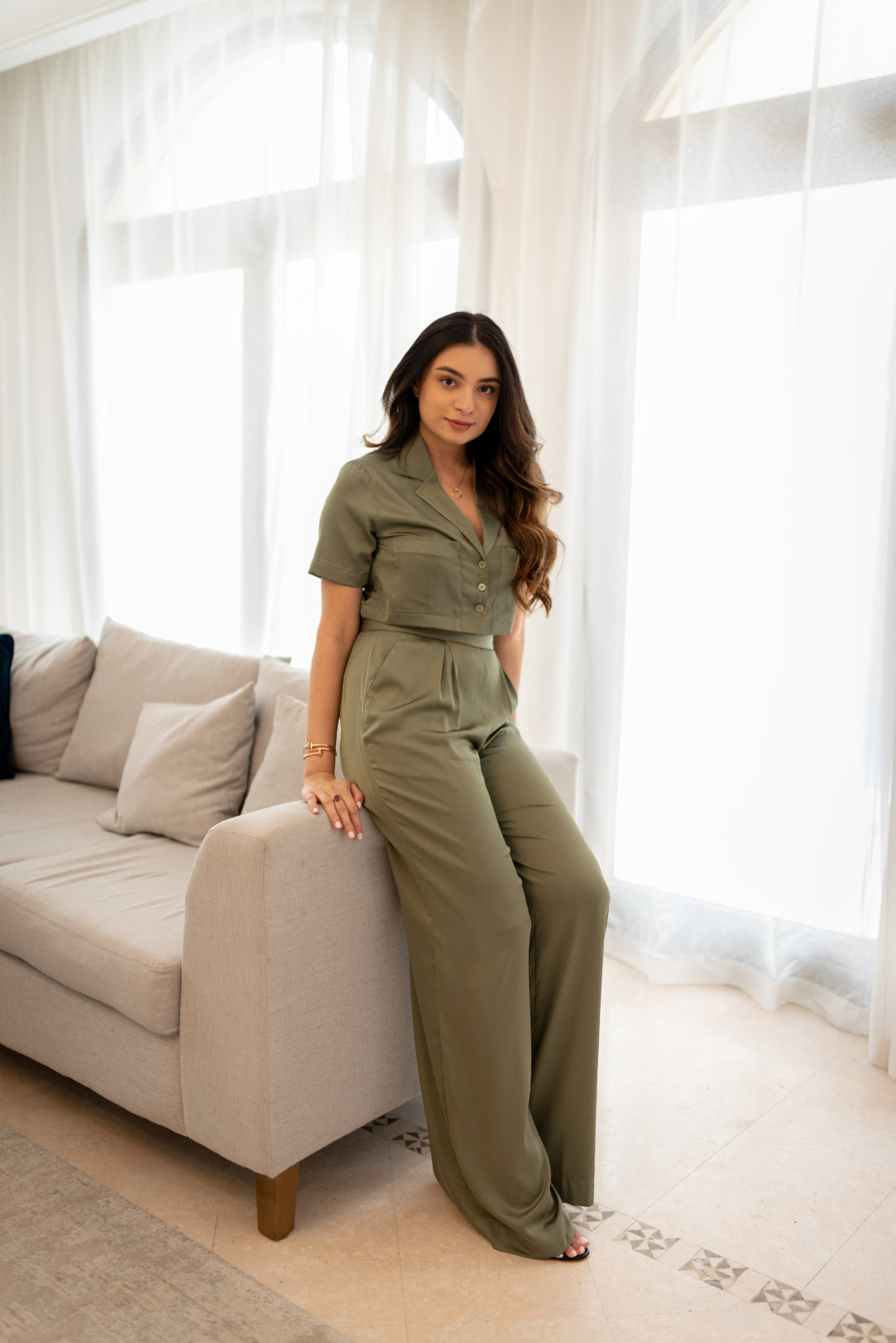 Girl posing in a grey coloured women clothing set made in soft silk