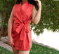 Red sleeveless side knot women blazer, paired with coordinated front zip shorts under.