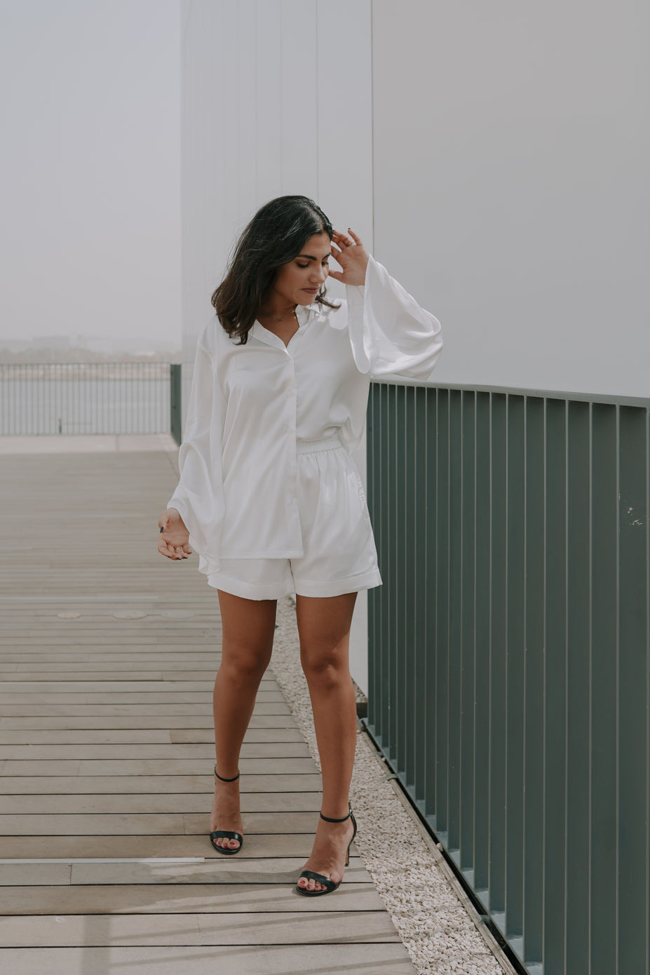 Girl posing in a simplistic white womens loungewear